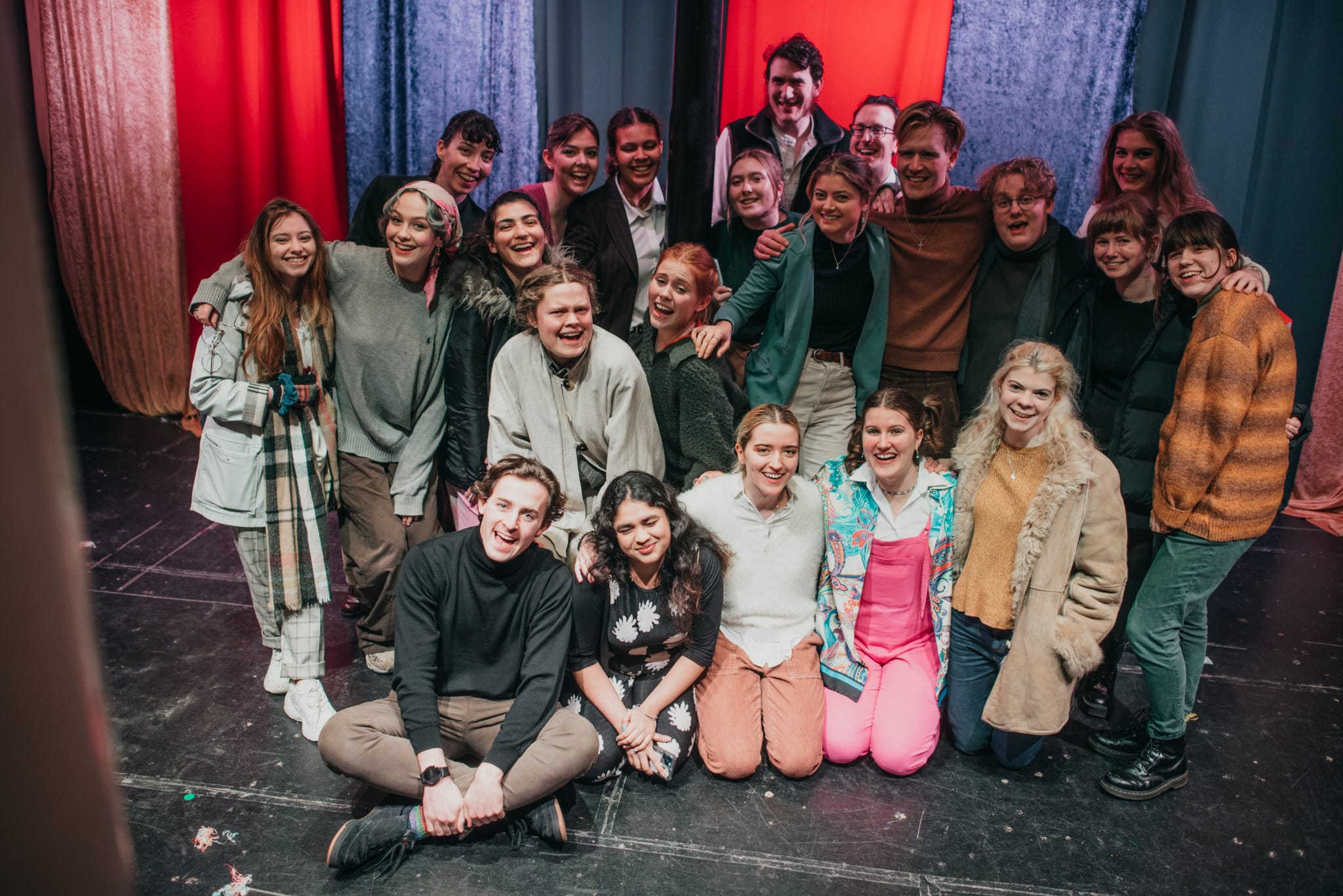 A photo of a production cast after a performance
